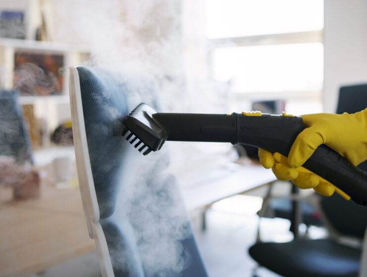 professional-cleaning-service-person-using-steam-cleaner-office